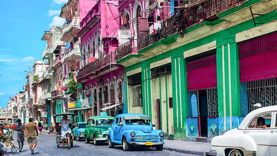 Colourful buildings of a busy street in Havana