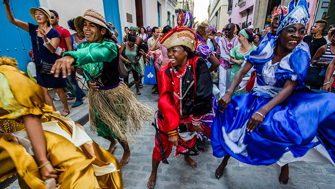People dancing on the street in a cultural celebration in Havana