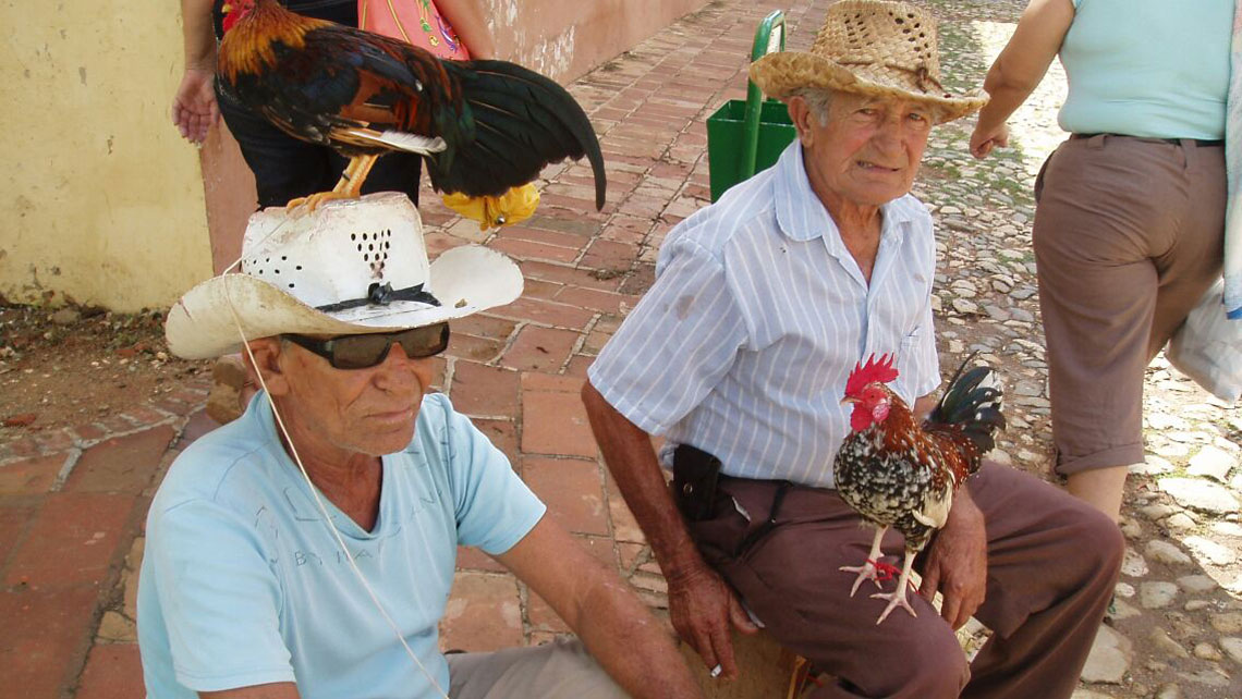 Two old men seating on a corner of Trinidad
