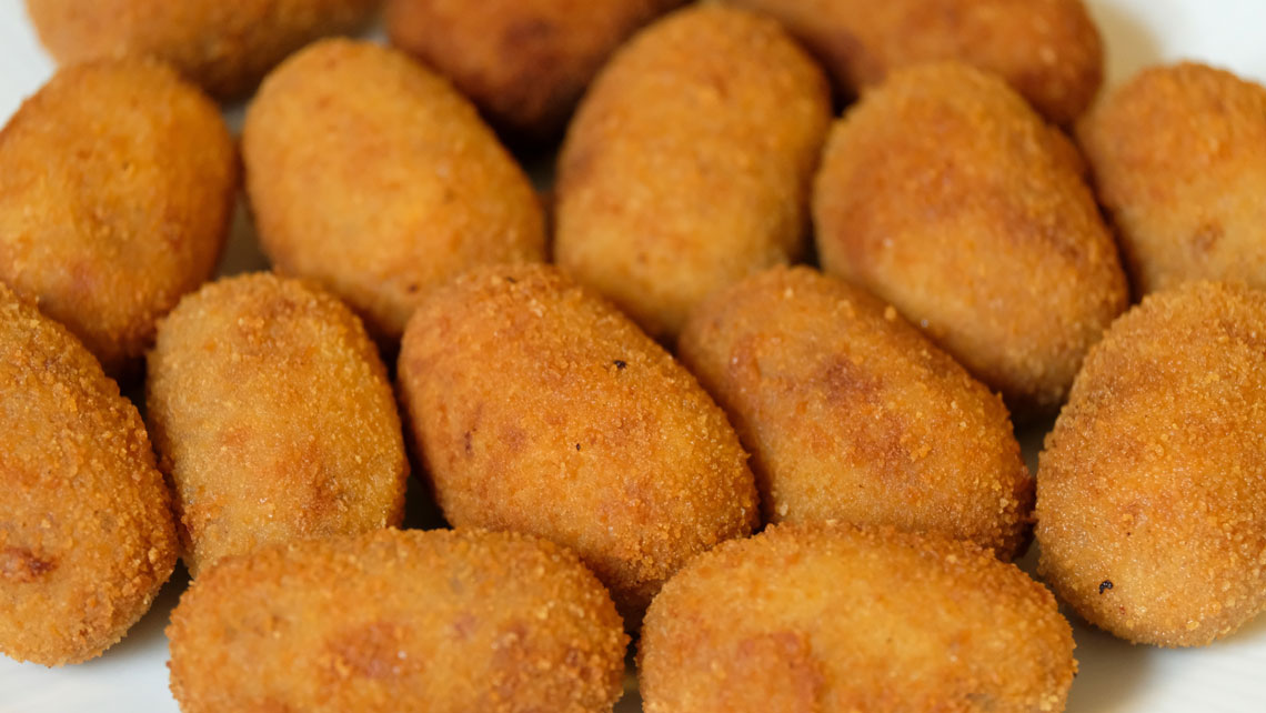 A dish of Cuban Croquetas
