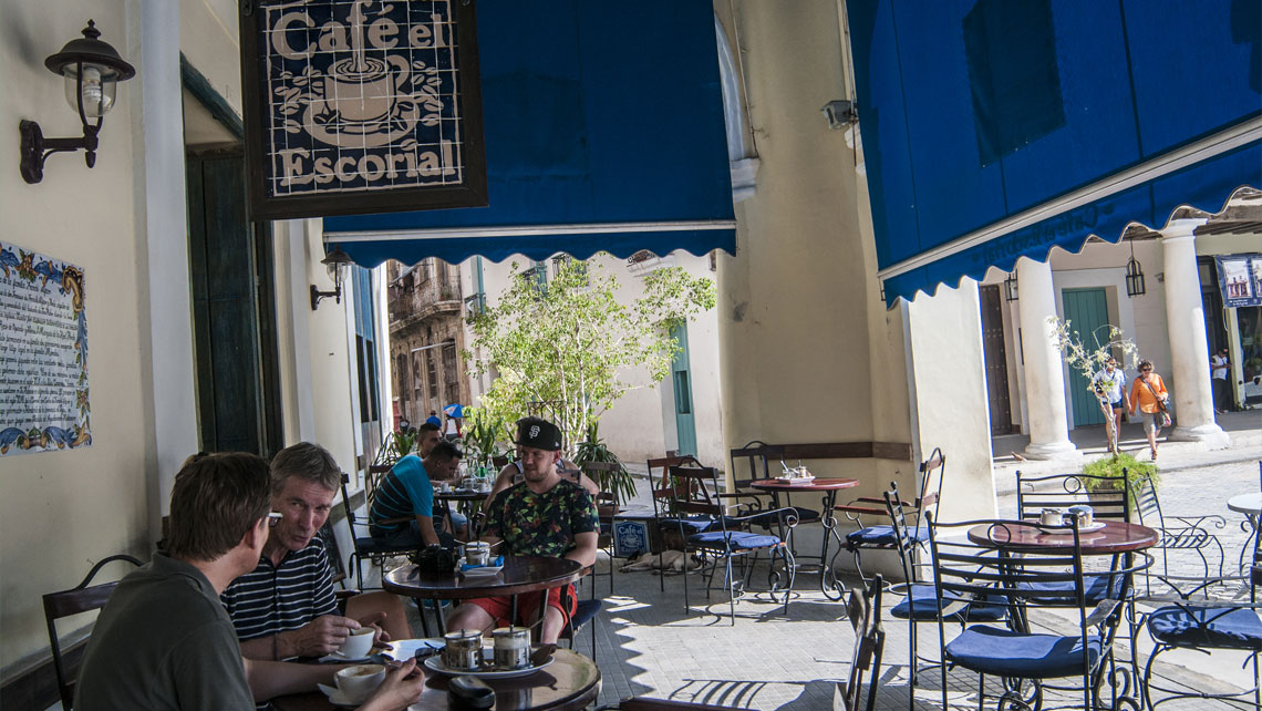 People enjoying a cup of Cuban coffee at Cafe El Escorial