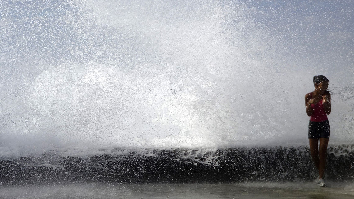 Waves crashing into El Malecon in a stromy day