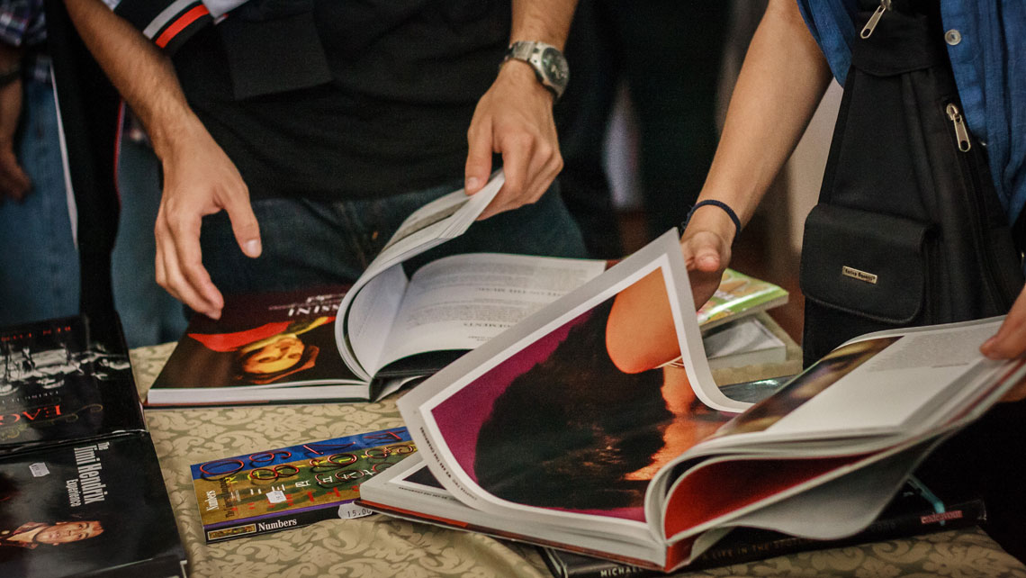 People checking a selection of books during the International Book Fair in Havana