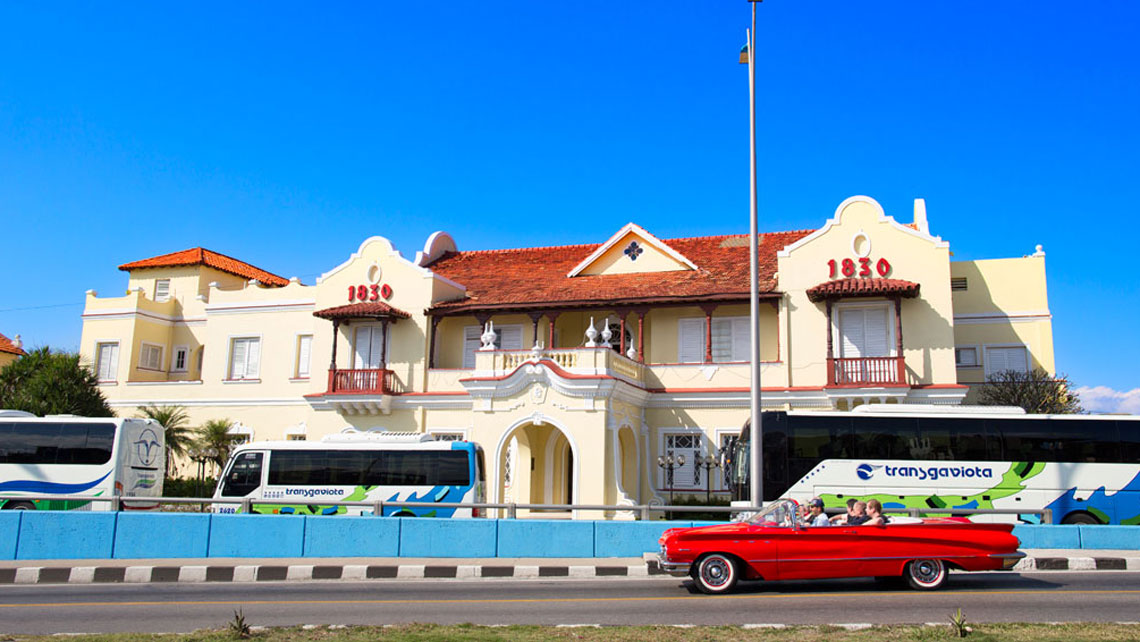 Cars passing in front of Club 1830
