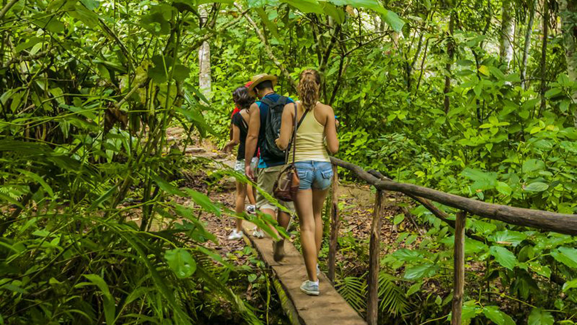 People walking on a bridge on their way to Martin Infierno Cave