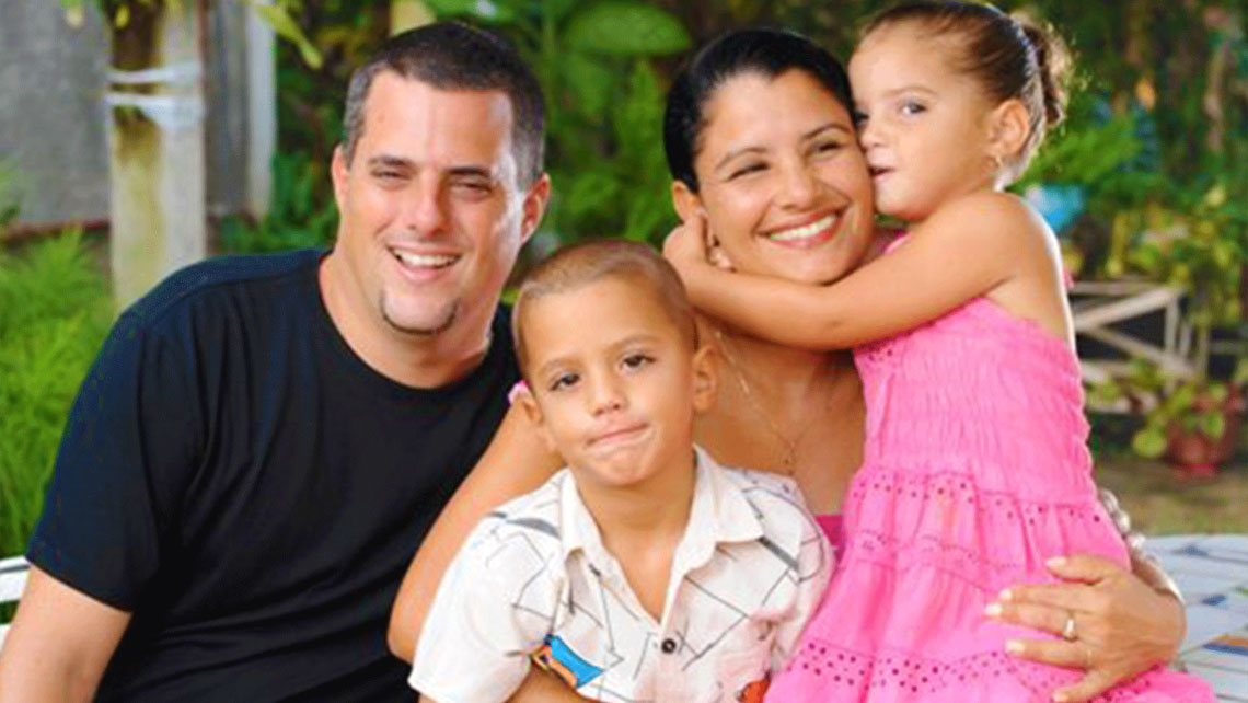 A happy family posing for a picture