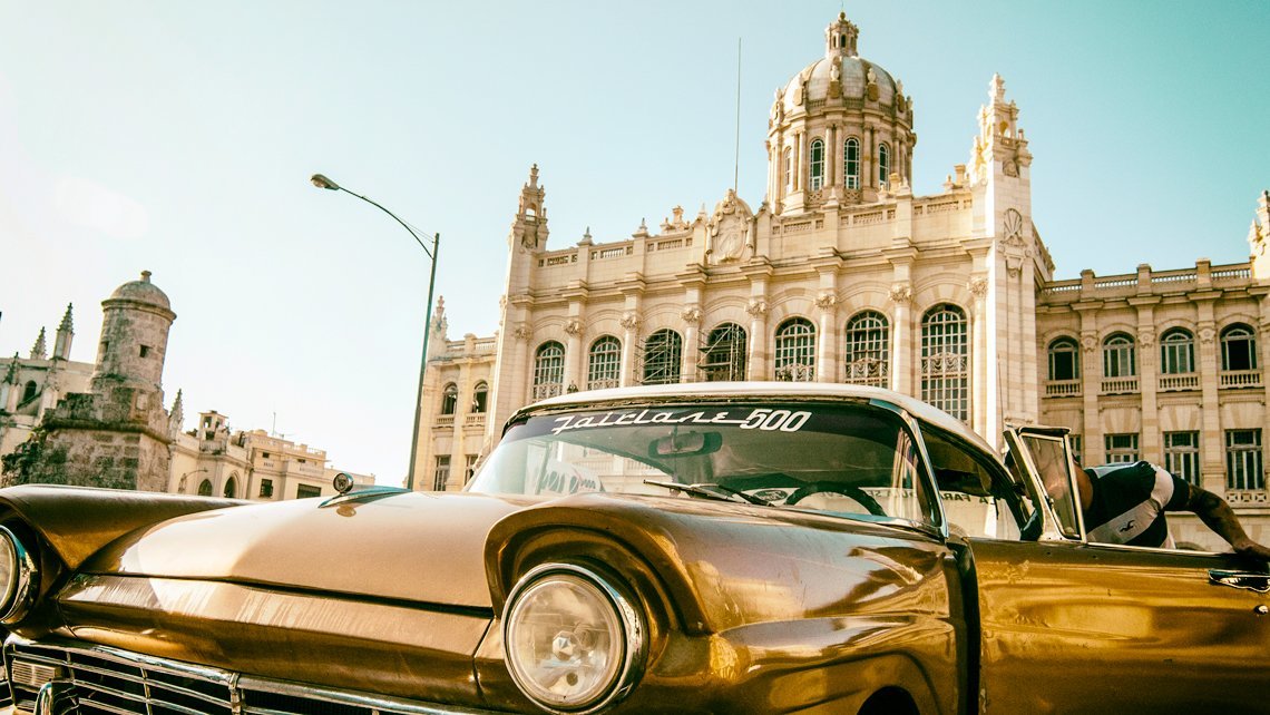 A vintage american car in front of Museo de la Revolucion in Havana