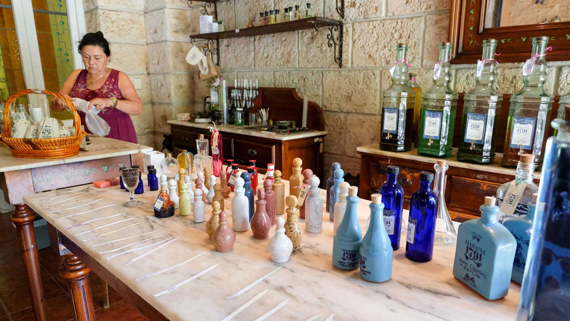 A woman packing handmade soaps in boutique like perfume shop in Old Havana