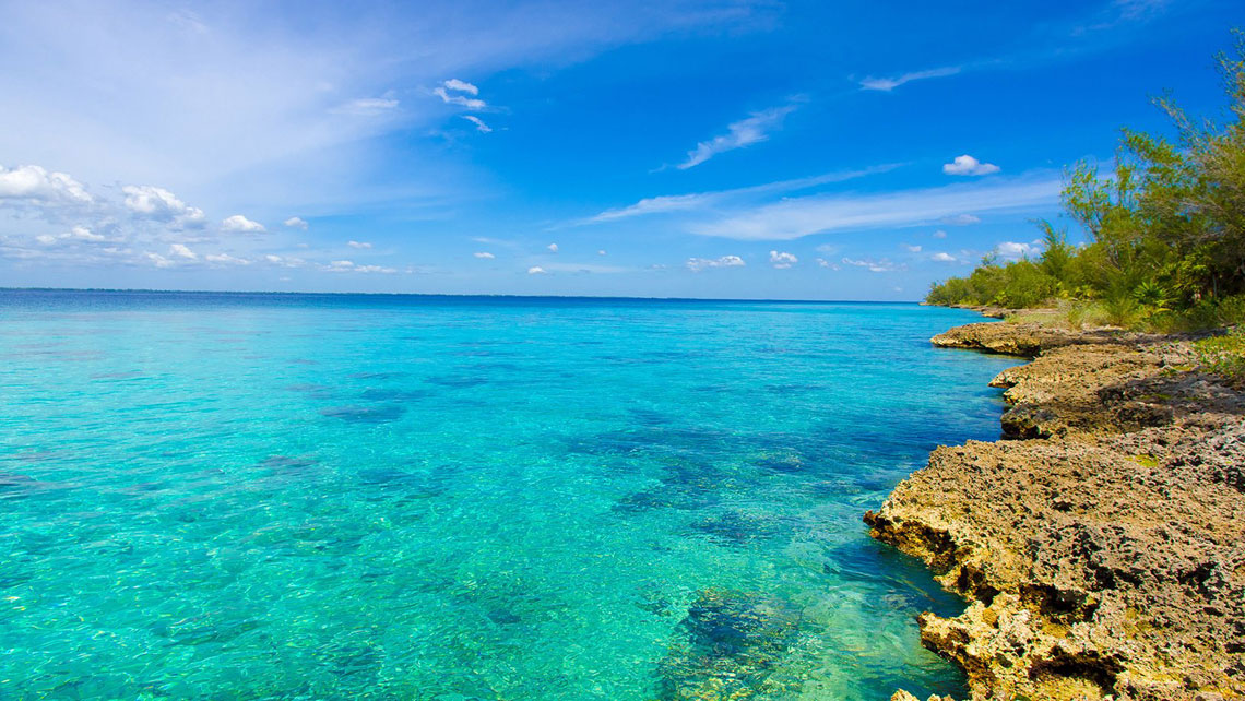 Clear water near rocky formations