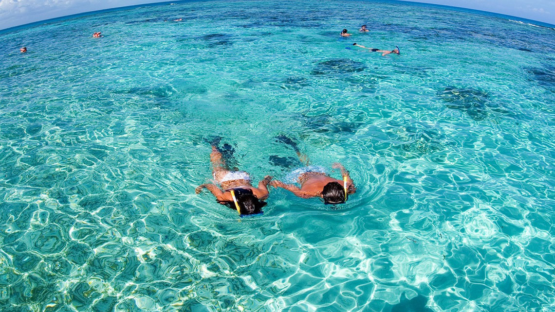 A young couple snorkelling in Playa Ancon