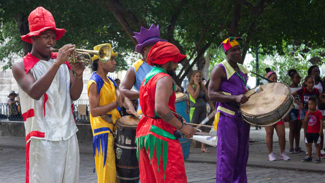 Colourful street performers adorn the cobbled alleys of Old Havana with their drumming and dancing