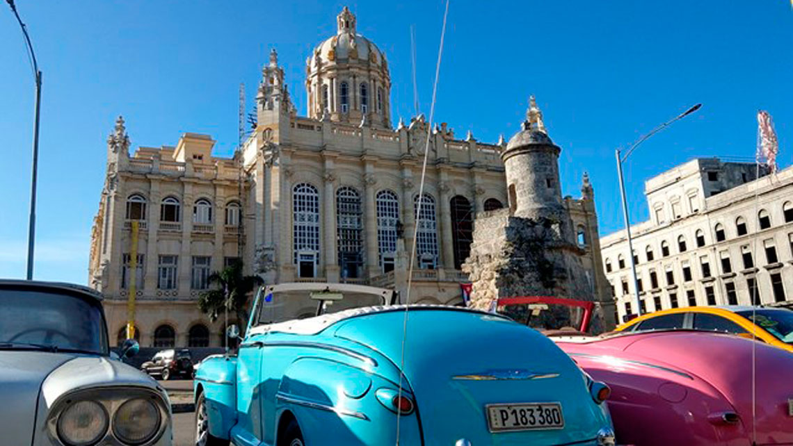 Vintage american cars parked in front of Museo de la Revolucion in Havana