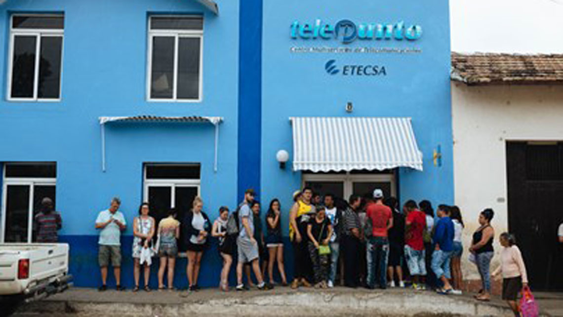 People queing in front of one shop of ETECSA (the Cuban telecommunications company)to buy WiFi card 