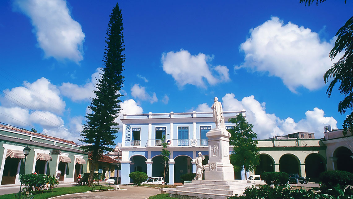 Elegant Hotel del Rijo viewed from Honorato del Castillo Park in Sancti Spiritus