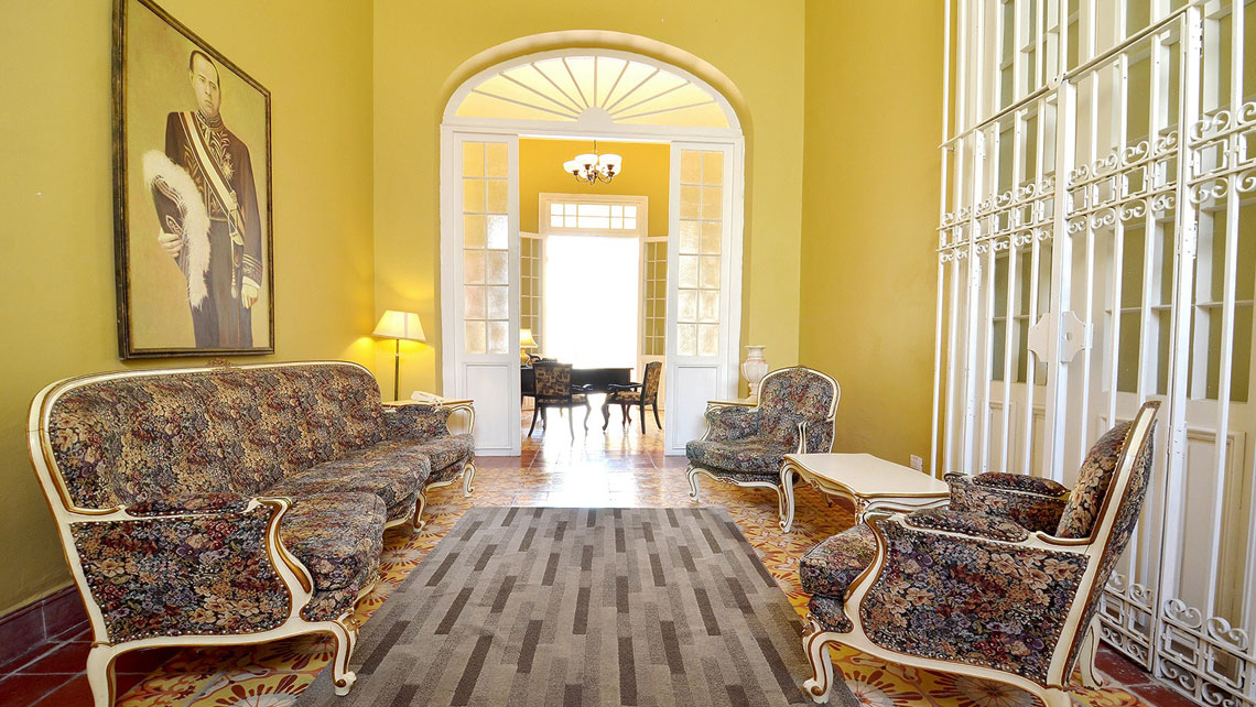 Colonial-style wooden furniture and elegant decoration in Hotel El Marqués, Camaguey