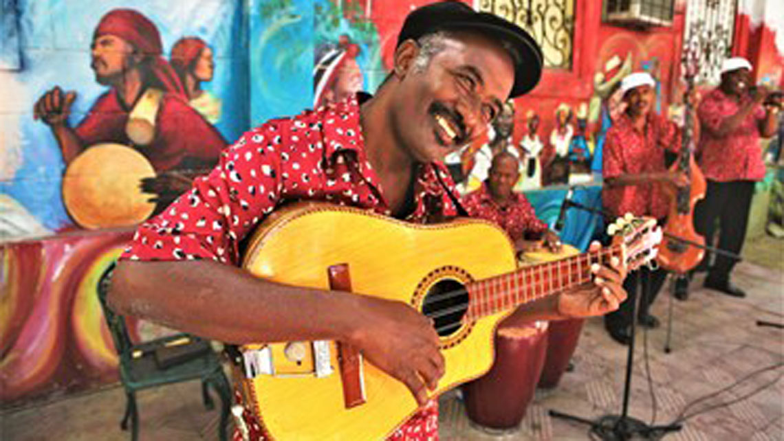 A local playing the Cuban Tres guitar