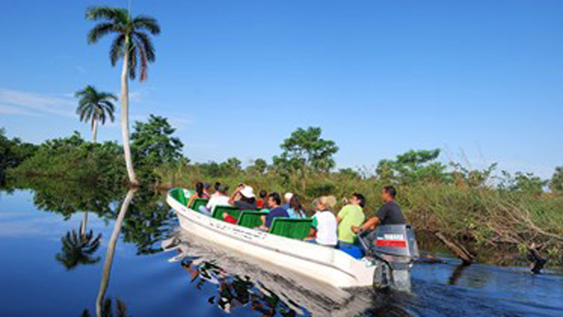 A group of tourist during a guide tour in a boat