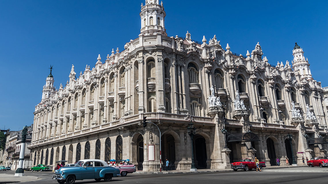 Old vintage car passing by Grand Theatre of Havana Alicia Alonso