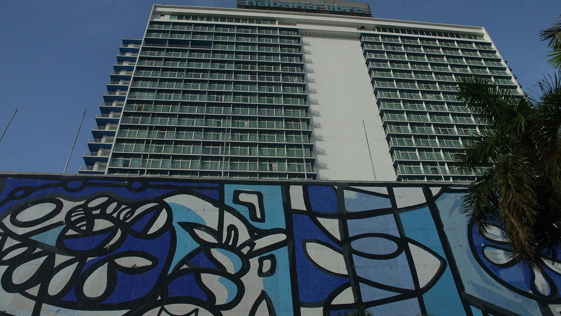 Facade of the Habana Libre hotel featuring an iconic mural by Amelia Pelaez