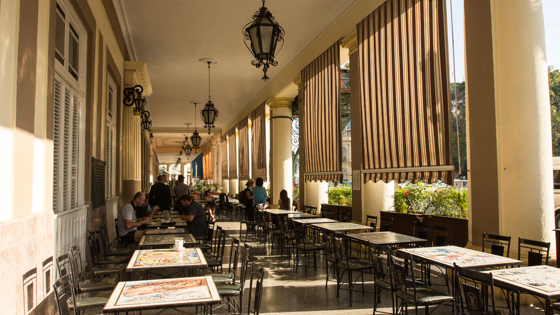 A sidewalk cafe in the ground floor of Hotel Inglaterra