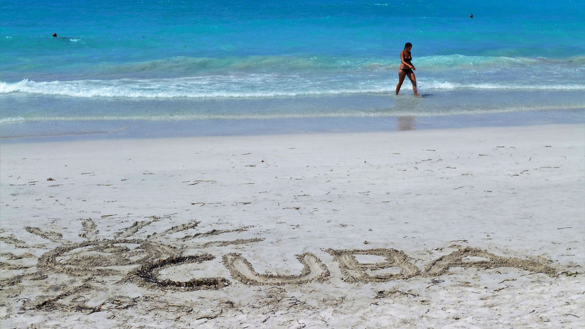The word Cuba left in the sand by a beachgoer is seen in Varadero Beach
