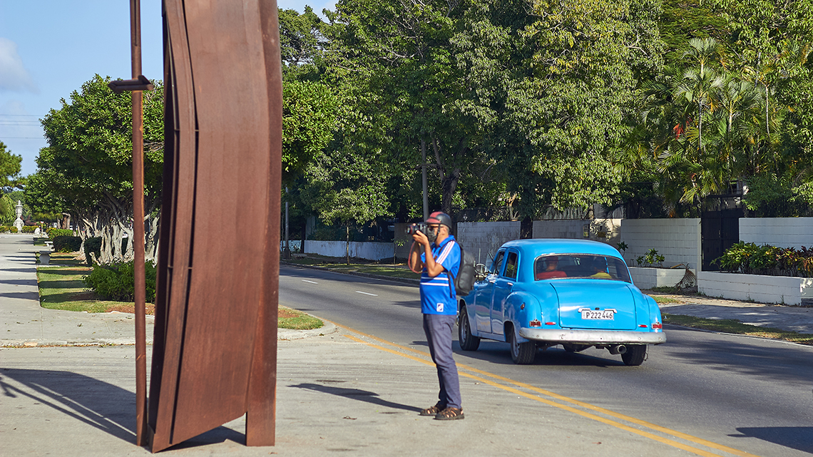 Photographer taking photos of one Kcho sculpture part of 14th Havana's Biennial