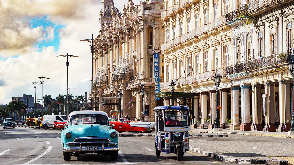 Havana City returning to normality after COVID, vintage American car from 1950s near Prado y Neptuno